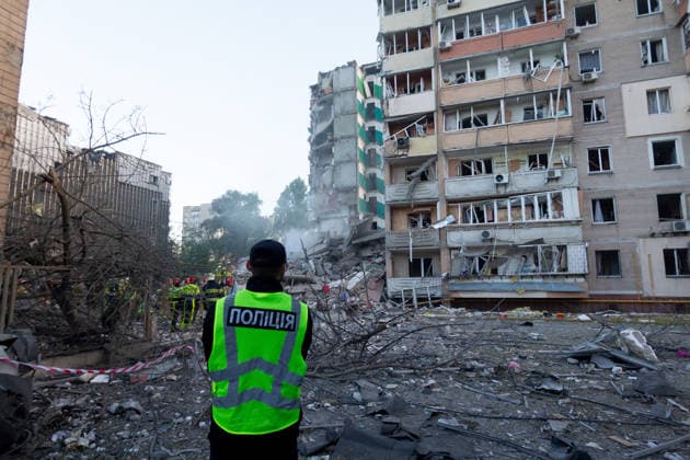 Kyiv comes under massive attack of Russian drones and missiles A police officer watches rescuers work at nine-storey apartment blocks damaged by a Russian missile and drone strike in Kyiv, Ukraine, on May 14, 2026. Russia launched a massive attack on the Ukrainian capital, deploying more than 670 strike drones and 56 missiles of various types. The attack damaged 11 multi-storey residential buildings, cars, a supermarket, two car dealerships, two petrol stations, a business centre, and a service station. At least one person was killed, and 33 were injured, including a two-month-old baby., Credit:Kirill Chubotin Ukrinform Avalon Ukraine, Kyiv Copyright: xKirillxChubotinx xUkrinformx xAvalonx 1098838361