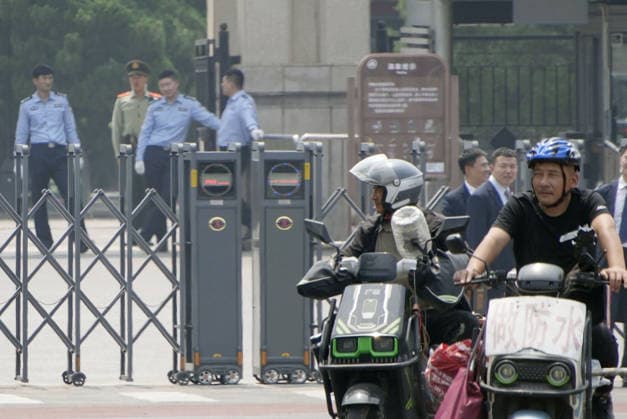U.S. President Trump in Beijing Police officers (back) patrol at the Temple of Heaven in Beijing on May 14, 2026, as U.S. President Donald Trump visits the Chinese capital for a summit meeting with Chinese President Xi Jinping.  A14AA0005555528P