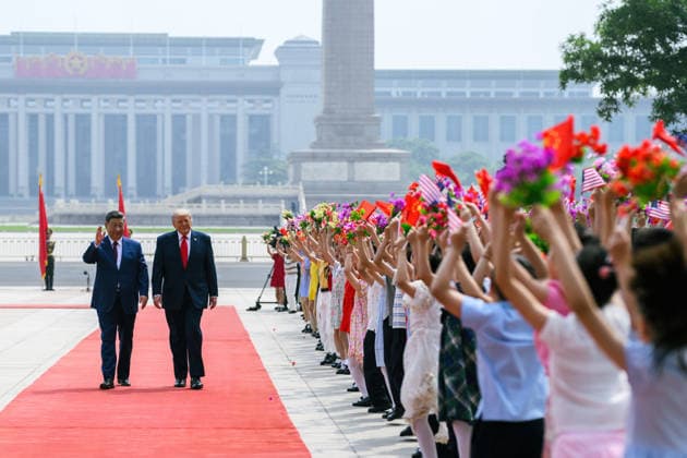 May 14, 2026, Beijing, China: Chinese President Xi Jinping, left, escorts U.S. President Donald Trump, past flag waving school children during the official welcoming ceremony at the Great Hall of the People, May 14, 2026 in Beijing, China. Beijing China - ZUMAp138 20260514_zaa_p138_031 Copyright: xHandout WhitexHousex