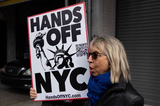 Protest against ICE held in New York City NEW YORK, UNITED STATES - MAY 14: A woman holds a banner as people holding banners and signs take part in a rally and protest outside a Metropolis Garage, in Manhattan demanding that the company stop collaborating with ICE and the Department of Homeland Security by allowing their vehicles to be parked in its garage, in New York City, New York, U.S., May 14, 2026. Mostafa Bassim Anadolu New York United States. Editorial use only. Please get in touch for any other usage.  Copyright: x2026xAnadoluxMostafaxBassimx