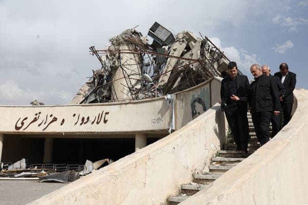 May 13, 2026, Tehran, Iran: Iranian President MASOUD PEZESHKIAN and Minister of Sport and Youth AHMAD DONYAMALI visit a heavily damaged building at Azadi Indoor Stadium following a strike in western Tehran. The United States and Israel started striking Iran on February 28, killing Iran s supreme leader and top military leaders, and prompting authorities to retaliate with strikes on Israel and across the Gulf. Iran s chief negotiator said on May 12 that Washington must accept Tehran s latest peace plan or face failure, after US President Donald Trump warned the truce in the Middle East war was on the brink of collapse. Tehran Iran - ZUMAi98_ 20260513_zih_i98_277 Copyright: xIranianxPresidencyx