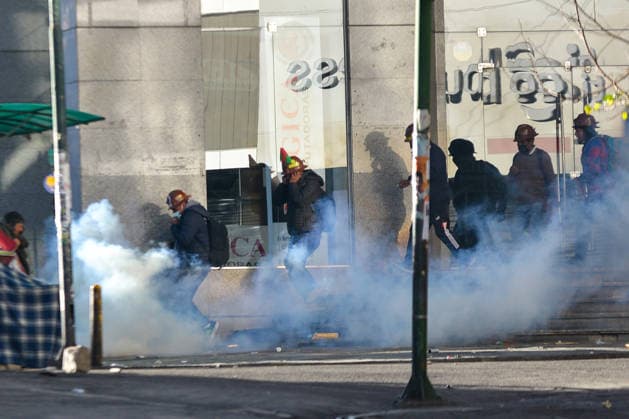 Miners attempt to break through police cordon in La Paz LA PAZ, BOLIVIA - MAY 14: Miners flee from tear gas fired by police attempting to disperse protesters during clashes over demands for fuel supplies, access to explosives and improved mining conditions in downtown La Paz, Bolivia, on May 14, 2026. Carlos Sanchez Navas Anadolu La Paz Bolivia. Editorial use only. Please get in touch for any other usage.  Copyright: x2026xAnadoluxCarlosxSanchezxNavasx