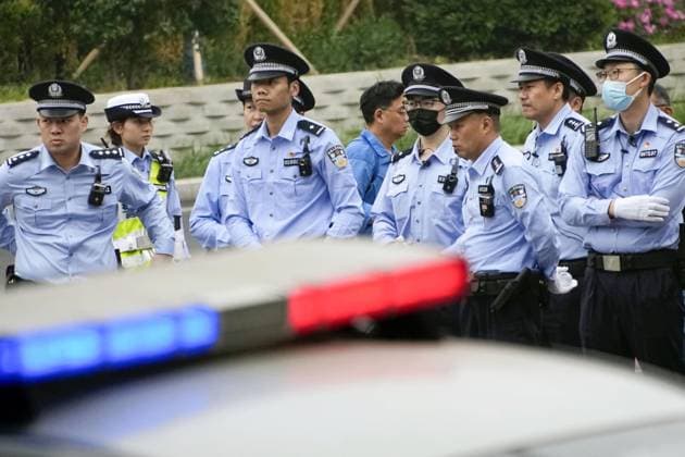 Tightened security in Beijing Police officers patrol Beijing on May 15, 2026, amid heightened security during the second day of summit talks between U.S. President Donald Trump and Chinese President Xi Jinping.  A14AA0005560125P