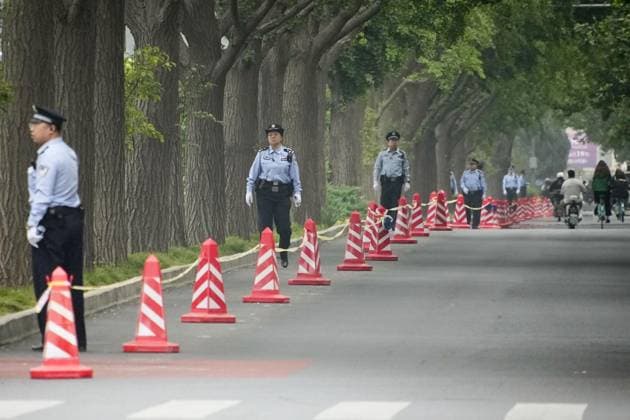 Tightened security in Beijing Police officers stand guard in Beijing on May 15, 2026, during the second day of summit talks between U.S. President Donald Trump and Chinese President Xi Jinping.  A14AA0005560128P
