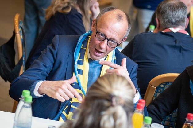Katholikentag 2026 in Würzburg Federal Chancellor at the catering for volunteers Federal Chancellor Friedrich Merz visits the Katholikentag and takes part in the catering for volunteers, Würzburg Bavaria Germany Place of remembrance ILBA