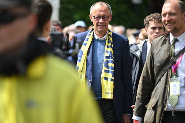 Chancellor Friedrich Merz CDU wears a Katholikentag scarf on his tour of the Katholikentag in Wuerzburg Photo from 15 05 2026 Several tens of thousands of participants are expected to attend a total Copyright: epd-bild DanielxPeter DSC_1510.jpeg