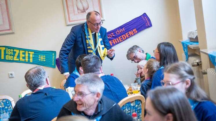 Katholikentag 2026 in Würzburg Federal Chancellor at the catering for volunteers Federal Chancellor Friedrich Merz visits the Katholikentag and takes part in the catering for volunteers, Würzburg Bavaria Germany Place of remembrance ILBA