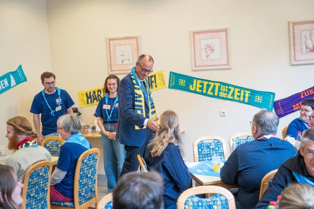 Katholikentag 2026 in Würzburg Federal Chancellor at the catering for volunteers Federal Chancellor Friedrich Merz visits the Katholikentag and takes part in the catering for volunteers, Würzburg Bavaria Germany Place of remembrance ILBA