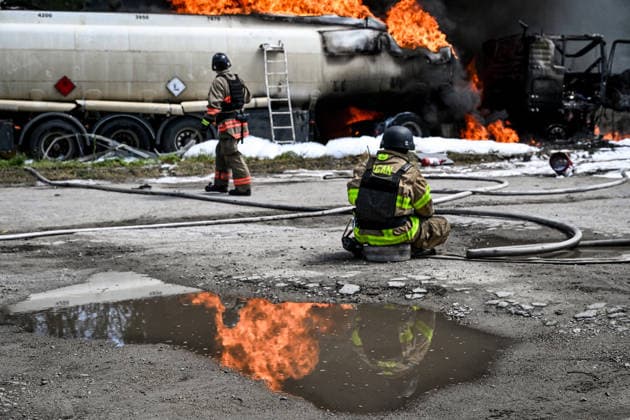 Rescuers extinguish burning tank trucks used by a private company to supply petrol station chains after a Russian drone attack in Zaporizhzhia, Ukraine, on May 15, 2026. Russian troops struck an industrial facility, damaging a fuel cistern and causing tank trucks to catch fire. One civilian employee (a driver) was killed, and three other company employees sustained serious injuries in the explosion. (Photo by Dmytro Smolienko Ukrinform) Russian troops strike fuel truck fleet in Zaporizhzhia  Copyright: xDmytroxSmolienkox
