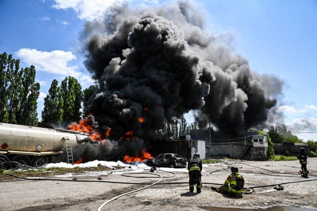 Rescuers extinguish burning tank trucks used by a private company to supply petrol station chains after a Russian drone attack in Zaporizhzhia, Ukraine, on May 15, 2026. Russian troops struck an industrial facility, damaging a fuel cistern and causing tank trucks to catch fire. One civilian employee (a driver) was killed, and three other company employees sustained serious injuries in the explosion. (Photo by Dmytro Smolienko Ukrinform) Russian troops strike fuel truck fleet in Zaporizhzhia  Copyright: xDmytroxSmolienkox