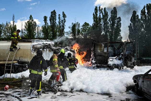 Rescuers use foam to extinguish burning tank trucks used by a private company to supply petrol station chains after a Russian drone attack in Zaporizhzhia, Ukraine, on May 15, 2026. Russian troops struck an industrial facility, damaging a fuel cistern and causing tank trucks to catch fire. One civilian employee (a driver) was killed, and three other company employees sustained serious injuries in the explosion. (Photo by Dmytro Smolienko Ukrinform) Russian troops strike fuel truck fleet in Zaporizhzhia  Copyright: xDmytroxSmolienkox