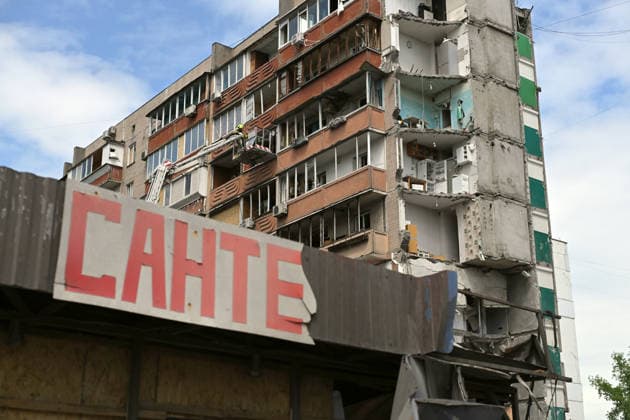 A plumbing shop is outside a nine-storey apartment block in the Darnytskyi district, where a Russian missile destroyed a section, Kyiv, Ukraine, May 15, 2026. The residential building was struck by a Russian missile, allegedly a Kh-101, at around 3:00 a.m. local time on 14 May. The missile detonated inside the building, causing an entire section to collapse, killing 24 people, including three children, and injuring 48 others. The search and rescue operation lasted more than 28 hours, during which the State Emergency Service rescued 30 residents. (Photo by Yevhen Kotenko Ukrinform) Foreign diplomats visit Kyiv apartment block hit by Russian missile Copyright: xEVGEN_KOTENKOx