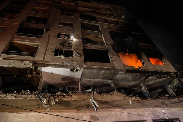 (260515) -- GAZA CITY, May 15, 2026 -- Photo taken on May 15, 2026 shows the damage caused to an apartment building following an Israeli airstrike in al-Rimal neighborhood in Gaza City. Seven Palestinians were killed and at least 50 others injured on Friday evening in Israeli strikes targeting a residential apartment and a vehicle in Gaza City, according to Palestinian medical sources. (Photo by Xinhua) MIDEAST-GAZA CITY-ISRAELI STRIKES-DAMAGE RizekxAbdeljawad 