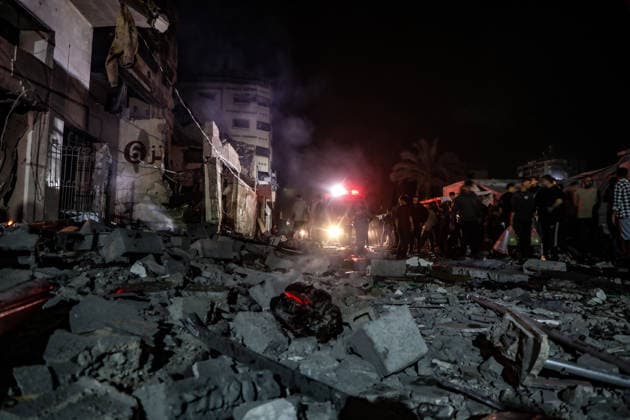 (260515) -- GAZA CITY, May 15, 2026 -- Palestinians inspect the damage caused to an apartment building following an Israeli airstrike in al-Rimal neighborhood in Gaza City, May 15, 2026. Seven Palestinians were killed and at least 50 others injured on Friday evening in Israeli strikes targeting a residential apartment and a vehicle in Gaza City, according to Palestinian medical sources. (Photo by Xinhua) MIDEAST-GAZA CITY-ISRAELI STRIKES-DAMAGE RizekxAbdeljawad 