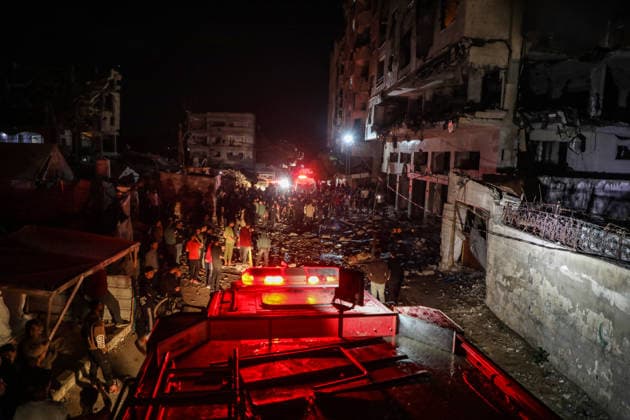(260515) -- GAZA CITY, May 15, 2026 -- Palestinians inspect the damage caused to an apartment building following an Israeli airstrike in al-Rimal neighborhood in Gaza City, May 15, 2026. Seven Palestinians were killed and at least 50 others injured on Friday evening in Israeli strikes targeting a residential apartment and a vehicle in Gaza City, according to Palestinian medical sources. (Photo by Xinhua) MIDEAST-GAZA CITY-ISRAELI STRIKES-DAMAGE RizekxAbdeljawad 