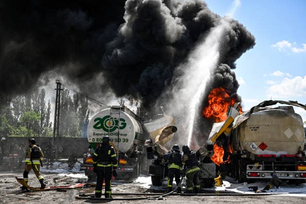 Russian troops strike fuel truck fleet in Zaporizhzhia Rescuers extinguish burning tank trucks used by a private company to supply petrol station chains after a drone strike in Zaporizhzhia, Ukraine, on May 15, 2026. The incident at an industrial facility resulted in damage to a fuel cistern and caused tank trucks to catch fire. One civilian employee, a driver, was killed, and three other company employees sustained serious injuries in the explosion. Zaporizhzhia Ukraine  Copyright: xDmytroxSmolienkox originalFilename: ukrinform-russiant260515_npcWy.jpg