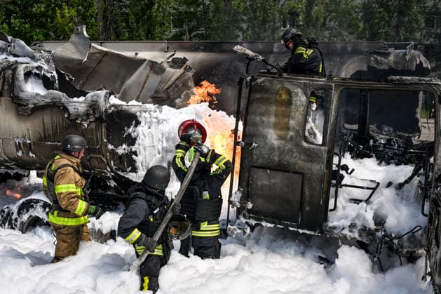 Russian troops strike fuel truck fleet in Zaporizhzhia Rescuers use foam to extinguish burning tank trucks used by a private company to supply petrol station chains in Zaporizhzhia, Ukraine, on May 15, 2026. An industrial facility was struck, damaging a fuel cistern and causing tank trucks to catch fire. One civilian employee, a driver, was killed, and three other company employees sustained serious injuries in the explosion. Zaporizhzhia Ukraine  Copyright: xDmytroxSmolienkox originalFilename: ukrinform-russiant260515_npvyO.jpg