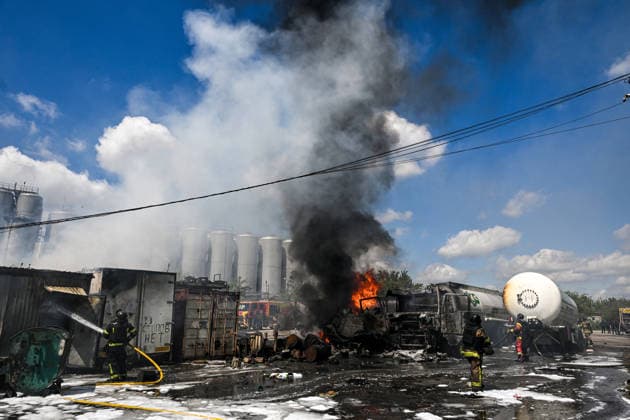 Russian troops strike fuel truck fleet in Zaporizhzhia Rescuers extinguish burning tank trucks used by a private company to supply petrol station chains after a drone strike in Zaporizhzhia, Ukraine, on May 15, 2026. The incident at an industrial facility resulted in damage to a fuel cistern and caused tank trucks to catch fire. One civilian employee, a driver, was killed, and three other company employees sustained serious injuries in the explosion. Zaporizhzhia Ukraine  Copyright: xDmytroxSmolienkox originalFilename: ukrinform-russiant260515_npPzr.jpg