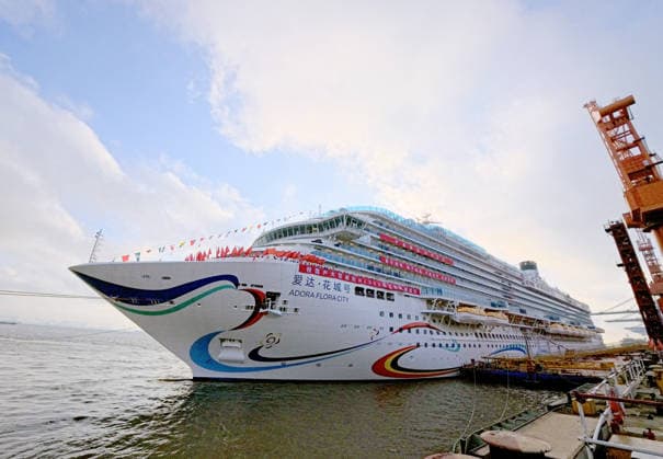 (260516) -- SHANGHAI, May 16, 2026 -- Cruise ship Adora Flora City prepares to set sail from Pier 5 of Shanghai Waigaoqiao Shipbuilding Co., Ltd. for a sea trial in Shanghai, east China, May 16, 2026. Adora Flora City, China s second domestically built large cruise ship, departed from Shanghai on Saturday for a 12-day sea trial. A total of 937 engineering and technical personnel from 12 countries participated in this trial voyage. The 341-meter-long vessel, with a gross tonnage of 141,900 tonnes, has 2,130 cabins and suites and can carry up to 5,232 passengers at full capacity. It is scheduled to be delivered on Nov. 6, 2026, and will begin its inaugural season from the Nansha International Cruise Home Port in Guangzhou, capital of s