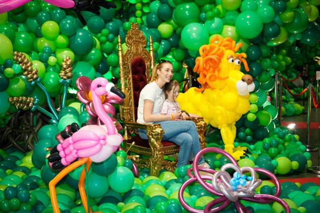 (260516) -- WARSAW, May 16, 2026 -- People pose for photos during the World Balloon Festival in Warsaw, Poland, May 15, 2026. The festival takes place here from May 15 to 17, featuring large themed installations featuring tropical jungles, underwater world, outer space and architectural landmarks created with more than 100,000 biodegradable balloons. (Photo by Xinhua) POLAND-WARSAW-WORLD BALLOON FESTIVAL JaapxArriens 