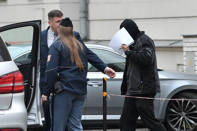A man (right) suspected of stealing a precious relic, the skull of Saint Zdislava of Lemberk, walks with his lawyer Vit Pavko (left) away from the district court that did not send him into custody, in Ceska Lipa, Czech Republic, on May 16, 2026. (CTKxPhoto VitxCerny) CTKPhotoP2026051602544  CTKPhotoP2026051602544