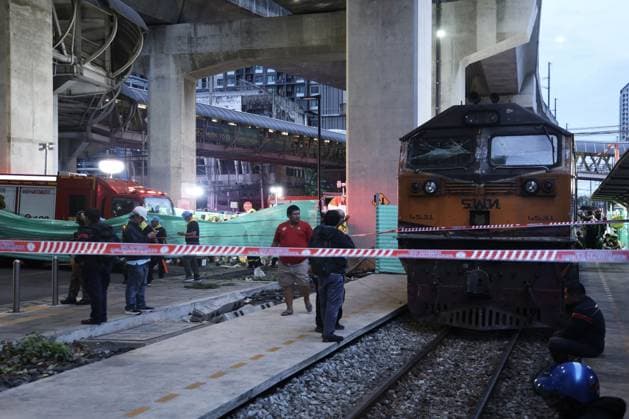 (260516) -- BANGKOK, May 16, 2026 -- Cordons are seen near the site of a train-bus collision in Bangkok, Thailand, May 16, 2026. A train and a bus collided in Bangkok, Thailand, on Saturday afternoon, killing eight people, local media reported. At around 3:40 p.m., a train collided with a bus at a railway crossing in Ratchathewi District, triggering a fire accompanied by an explosion. Several other cars and motorcycles were also involved. More than 20 people were injured, according to local media, as rescuers rushed to the scene to put out the fire and carry out rescue operations. ) (SpotNews) THAILAND-BANGKOK-TRAIN-BUS COLLISION SunxWeitong 