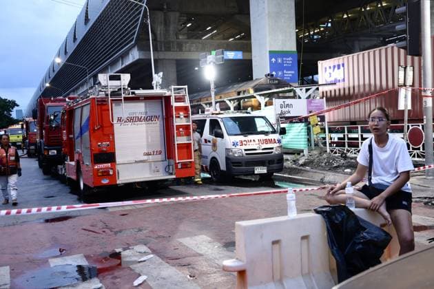 (260516) -- BANGKOK, May 16, 2026 -- Cordons are seen near the site of a train-bus collision in Bangkok, Thailand, May 16, 2026. A train and a bus collided in Bangkok, Thailand, on Saturday afternoon, killing eight people, local media reported. At around 3:40 p.m., a train collided with a bus at a railway crossing in Ratchathewi District, triggering a fire accompanied by an explosion. Several other cars and motorcycles were also involved. More than 20 people were injured, according to local media, as rescuers rushed to the scene to put out the fire and carry out rescue operations. ) (SpotNews) THAILAND-BANGKOK-TRAIN-BUS COLLISION SunxWeitong 