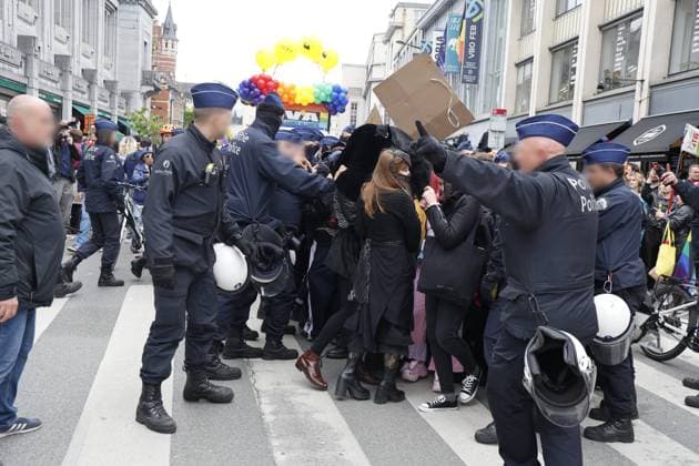 Police pictured during a protest near the N-VA parade float at the Brussels Pride parade through the streets of Brussels on Saturday 16 May 2026. Brussels Pride puts the LGBTQIA+ community in the spotlight by adorning the streets of Brussels with the colors of the rainbow.  NICOLASxMAETERLINCK 174050696