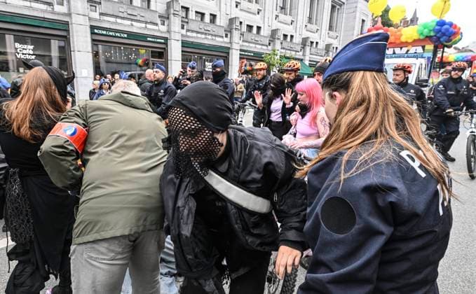 Brussels Pride Celebrates 30 Years BRUSSELS, BELGIUM - MAY 16: Protesters against the partiscipation of NV-A and MR to the Pride have to oppose the Police. The Pride march walks through the streets of the capital.This year marks the 30th anniversary of Pride in Brussels. Thirty years of struggle, pride and visibility for the LGBTQIA+ community. The theme chosen for 2026 reflects the challenges of a world in turmoil: When Times Get Darker, We Shine Brighter. A powerful and unifying message, more necessary than ever in a troubled international context where the rights of the LGBTQIA+ community are under constant threat.on May 16, 2026 in Brussels, Belgium, 16 05 2026 Brussels Belgium  Copyright: xBertxVanxDenxBrouckex
