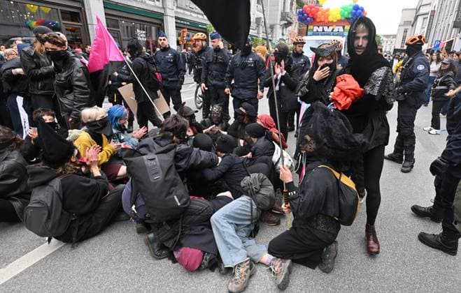 Brussels Pride Celebrates 30 Years BRUSSELS, BELGIUM - MAY 16: Protesters against the partiscipation of NV-A and MR to the Pride have to oppose the Police. The Pride march walks through the streets of the capital.This year marks the 30th anniversary of Pride in Brussels. Thirty years of struggle, pride and visibility for the LGBTQIA+ community. The theme chosen for 2026 reflects the challenges of a world in turmoil: When Times Get Darker, We Shine Brighter. A powerful and unifying message, more necessary than ever in a troubled international context where the rights of the LGBTQIA+ community are under constant threat.on May 16, 2026 in Brussels, Belgium, 16 05 2026 Brussels Belgium  Copyright: xBertxVanxDenxBrouckex