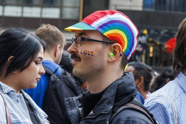 A man with rainbow cap pictured during the Brussels Pride parade through the streets of Brussels on Saturday 16 May 2026. Brussels Pride puts the LGBTQIA+ community in the spotlight by adorning the streets of Brussels with the colors of the rainbow.  NICOLASxMAETERLINCK 174058543
