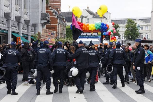 Police pictured during a protest near the N-VA float at the Brussels Pride parade through the streets of Brussels on Saturday 16 May 2026. Brussels Pride puts the LGBTQIA+ community in the spotlight by adorning the streets of Brussels with the colors of the rainbow.  NICOLASxMAETERLINCK 174059325