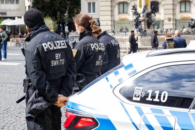 Augsburg, Bavaria, Germany May 16, 2026: Demonstration in Augsburg against the current federal government led by Chancellor Friedrich Merz. The slogan: Merz must go! Officers from the Bavarian State Police are securing the demonstration and monitoring the situation around the event area