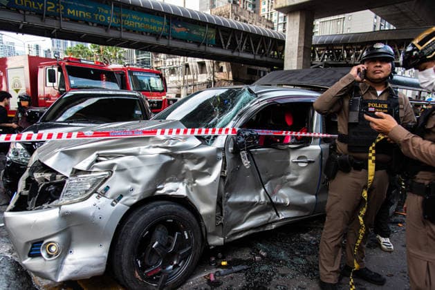 May 16, 2026, Bangkok, Thailand: Police officers seen inspect a wreckage vehicle after a public bus collides with a cargo train at the Makkasan airport rail link station. At least 8 people were killed and more than 25 people injured in the accident. Bangkok Thailand - ZUMAs197 20260516_aaa_s197_091 Copyright: xPeeraponxBoonyakiatx