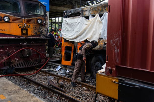 May 16, 2026, Bangkok, Thailand: A police officer seen inspects a burnt public bus after it collides with a cargo train at the Makkasan airport rail link station. At least 8 people were killed and more than 25 people injured in the accident. Bangkok Thailand - ZUMAs197 20260516_aaa_s197_086 Copyright: xPeeraponxBoonyakiatx
