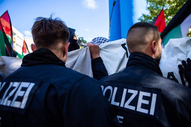 May 16, 2026, Berlin, Berlin, Germany: A tense moment between Berlin police and protesters during the Nakba 78 demonstration in Berlin. Police repeatedly pushed protesters who were trying to protect their identities behind the banners. Berlin Germany - ZUMAc291 20260516_zip_c291_007 Copyright: xMariaxCastrox