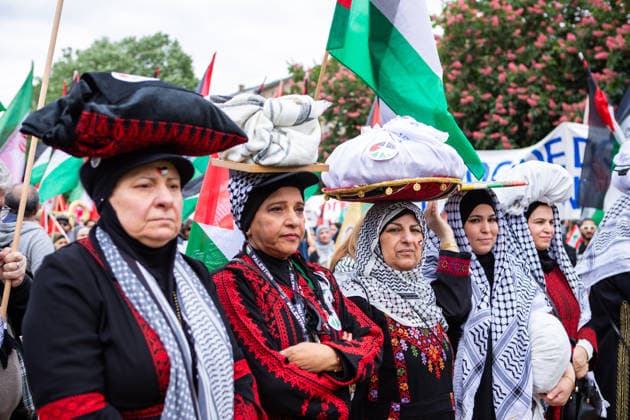 May 16, 2026, Berlin, Berlin, Germany: Women in traditional Palestinian dress take part in the 78th Nakba commemoration march in Berlin, carrying symbolic items and Palestinian flags. Berlin Germany - ZUMAc291 20260516_zip_c291_001 Copyright: xMariaxCastrox