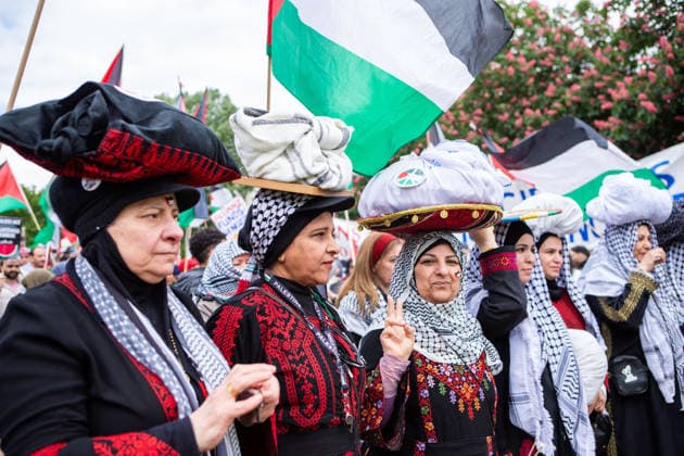 May 16, 2026, Berlin, Berlin, Germany: Women in traditional Palestinian dress take part in the 78th Nakba commemoration march in Berlin, carrying symbolic items and Palestinian flags. Berlin Germany  - ZUMAc291 20260516_zip_c291_002 Copyright: xMariaxCastrox