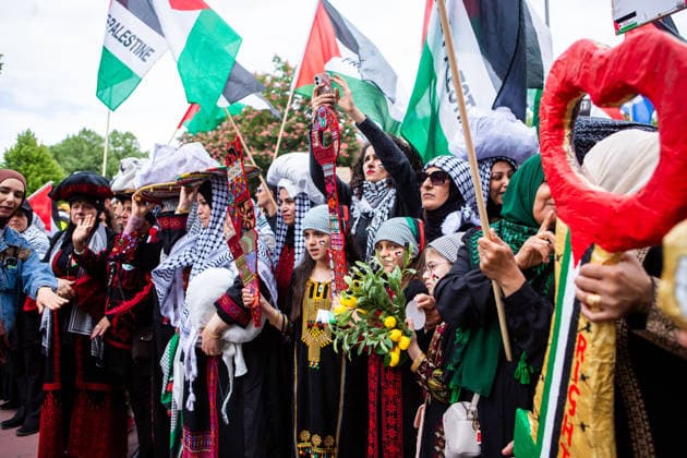 May 16, 2026, Berlin, Berlin, Germany: Women in traditional Palestinian dress take part in the 78th Nakba commemoration march in Berlin, carrying symbolic items and Palestinian flags. Berlin Germany  - ZUMAc291 20260516_zip_c291_004 Copyright: xMariaxCastrox