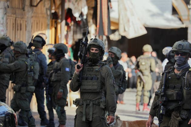 Hebron Israeli Settlers Tour May 16 Armed Israeli soldiers stand guard in a street in the Old City of Hebron, the occupied West Bank, on May 16, 2026. The area is routinely secured by troops to allow Israeli settlers to tour the city. Hebron West Bank Palestinian Territories Copyright: xMosabxShawerx