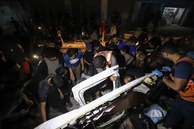 Destroyed Car Al-Nasr Street Gaza City Civil Defense workers and bystanders inspect the wreckage of a vehicle, targeted on Al-Nasr Street in Gaza City, Gaza Strip, on May 16, 2026. Gaza Gaza Strip Palestinian Territories Copyright: xAhmedxAlxArinix
