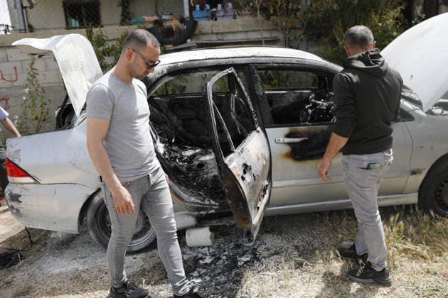 Palestinians inspect damage after settler attack near Hebron Palestinians inspect damage at the site of an attack carried out by Israeli settlers targeting Palestinian vehicles and property in the town of Surif northwest of Hebron in the occupied West Bank on May 17, 2026. Settlers set fire to a vehicle and spray-painted racist slogans at the scene, amid anger and condemnation among Palestinian residents over repeated attacks on their property. Photo by Mamoun Wazwaz apaimages Hebron West Bank Palestinian Territory 170526_Hebron_MW_00(14) Copyright: xapaimagesxMamounxWazwazx xapaimagesx