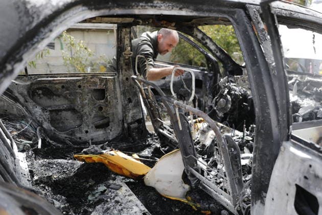 Palestinians inspect damage after settler attack near Hebron Palestinians inspect damage at the site of an attack carried out by Israeli settlers targeting Palestinian vehicles and property in the town of Surif northwest of Hebron in the occupied West Bank on May 17, 2026. Settlers set fire to a vehicle and spray-painted racist slogans at the scene, amid anger and condemnation among Palestinian residents over repeated attacks on their property. Photo by Mamoun Wazwaz apaimages Hebron West Bank Palestinian Territory 170526_Hebron_MW_00(30) Copyright: xapaimagesxMamounxWazwazx xapaimagesx