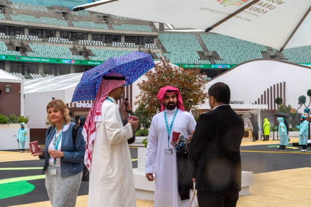 (260517) -- BAKU, May 17, 2026 -- Representatives communicate with each other at the venue for the 13th Session of the World Urban Forum (WUF 13) in Baku, Azerbaijan, May 17, 2026. The WUF 13 opened on Sunday, with global leaders, policymakers and urban experts gathering to discuss the challenges of rapid urbanization and sustainable city development. ) AZERBAIJAN-BAKU-WORLD URBAN FORUM-OPEN ChenxJunfeng 