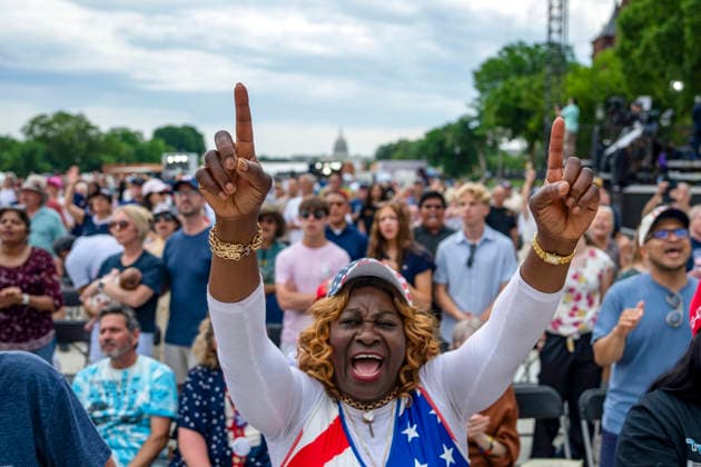 People worship during Rededicate 250 on the National Mall in Washington, DC on Sunday, May 17, 2026. The event, organized by Freedom 250 and the White House Faith Office, will feature political and faith leaders honoring 250 years of American history and encourage prayer or the country s next 250 years.  WAP20260517324 BONNIExCASH