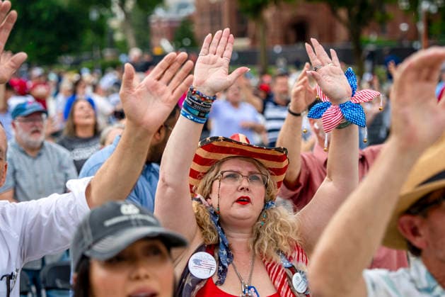 People worship during Rededicate 250 on the National Mall in Washington, DC on Sunday, May 17, 2026. The event, organized by Freedom 250 and the White House Faith Office, will feature political and faith leaders honoring 250 years of American history and encourage prayer or the country s next 250 years.  WAP20260517327 BONNIExCASH