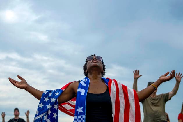 People worship during Rededicate 250 on the National Mall in Washington, DC on Sunday, May 17, 2026. The event, organized by Freedom 250 and the White House Faith Office, will feature political and faith leaders honoring 250 years of American history and encourage prayer or the country s next 250 years.  WAP20260517329 BONNIExCASH