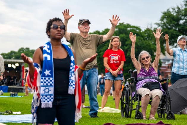 People worship during Rededicate 250 on the National Mall in Washington, DC on Sunday, May 17, 2026. The event, organized by Freedom 250 and the White House Faith Office, will feature political and faith leaders honoring 250 years of American history and encourage prayer or the country s next 250 years.  WAP20260517337 BONNIExCASH