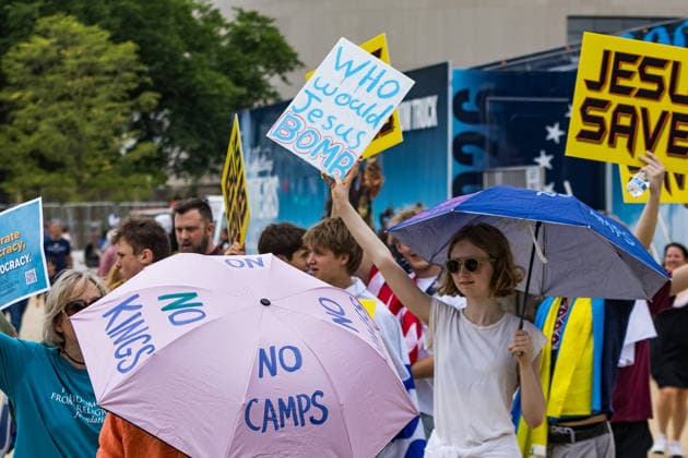 May 17, 2026, Washington, District Of Columbia, USA: A young woman holds a sign reading Ã¢â‚¬oeWho would Jesus bomb?Ã¢â‚¬Â outside the Ã¢â‚¬oeRededicate 250Ã¢â‚¬Â event on the National Mall Washington USA - ZUMAh196 20260517_znp_h196_020 Copyright: xTomxHudsonx