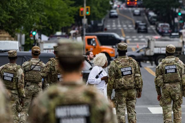 May 17, 2026, Washington, District Of Columbia, USA: Armed US Army National Guard troops surround a protester dressed in white robes outside the Ã¢â‚¬oeRededicate 250Ã¢â‚¬Â event on the National Mall. Washington USA - ZUMAh196 20260517_znp_h196_021 Copyright: xTomxHudsonx